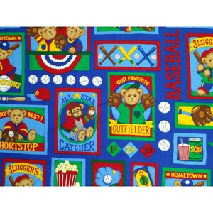 May include: A blue fabric with a repeating pattern of teddy bears playing baseball. The fabric features various baseball-themed images, including bats, balls, gloves, and a scoreboard. The text "Baseball", "All Star", "Catcher", "Outfielder", "Shortstop", "Sluggers", "Our Favorite", "Hometown", and "Best!" is included in the pattern.