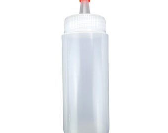 May include: A clear plastic squeeze bottle with a white cap and an orange tip. The bottle is cylindrical and designed for dispensing liquids. The cap has a textured surface for easy grip.