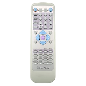 May include: A light gray Gateway remote control with numerous buttons. The buttons are various colors, including blue, purple, and white. The remote has buttons for power, music, photos, videos, search, display, menu, and return. The word "Gateway" is printed at the bottom.