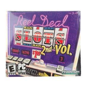 May include: A purple PC CD-ROM software box for Reel Deal Slots 2nd Vol. The front features a slot machine graphic with the text Reel Deal, Slots, 2nd Vol., and an ESRB Everyone E rating. The design includes dollar signs and game controls.