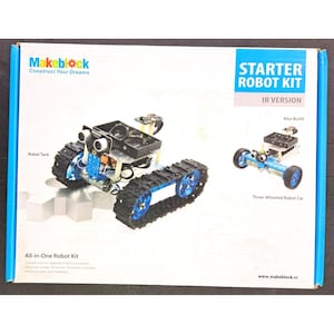 May include: A Makeblock Starter Robot Kit box featuring an IR version robot tank with black treads and blue wheels, and a three-wheeled robot car. The white packaging displays the product name, components, and the website address www.makeblock.cc.
