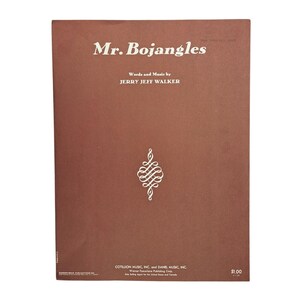 May include: Sheet music cover for "Mr. Bojangles" by Jerry Jeff Walker. The cover is a solid brown with white text and a decorative white design. The title and author's name are prominently displayed.
