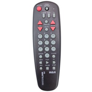 May include: A black RCA Systemlink 3 remote control with red and gray buttons. The remote has buttons for power, volume, channel, and number keys. The RCA logo is visible on the bottom right.