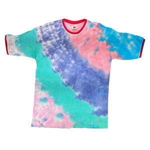 May include: A tie-dye t-shirt with a red collar and sleeve trim. The shirt features a blend of colors, including pink, blue, and teal, creating a vibrant, swirled pattern. The shirt is made of a soft material.