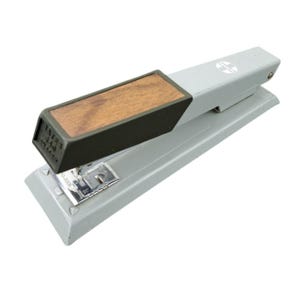May include: A gray stapler with a wooden handle and a black trim. The stapler has a silver metal base and a logo on the top. The text "BATES 340" is printed on the front.