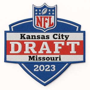 May include: Embroidered patch featuring the NFL logo and the text "Kansas City DRAFT Missouri 2023." The patch has a blue, white, and red color scheme, with a shield shape and a football design.