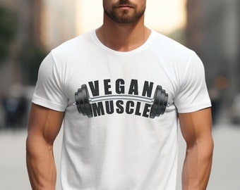 May include: White t-shirt with a black graphic of a barbell with the text "VEGAN MUSCLE" on it.