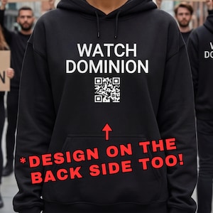 Puede incluir: Sudadera con capucha negra con el texto "WATCH DOMINION" y un código QR. La imagen también incluye el texto "*DESIGN ON THE BACK SIDE TOO!". Personas en el fondo sostienen carteles que dicen "GO VEGAN" y "ANIMAL RIGHTS".