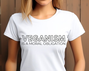 May include: White t-shirt with black text that reads "Veganism is a moral obligation."