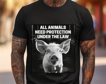 May include: Black t-shirt with a white graphic of a pig in a pen and the text "ALL ANIMALS NEED PROTECTION UNDER THE LAW".