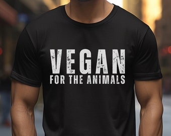 May include: A black t-shirt with white text that reads "VEGAN FOR THE ANIMALS".