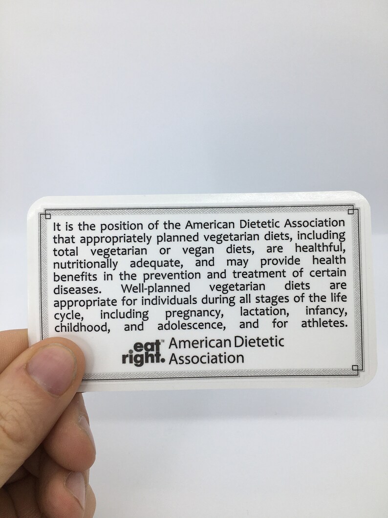 May include: A white card with black text stating that the American Dietetic Association supports appropriately planned vegetarian diets. The card also includes the text "eat right. Association".