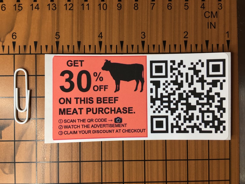 May include: A red and white coupon with a black silhouette of a cow and the text "GET 30% OFF ON THIS BEEF MEAT PURCHASE."  A QR code is on the right side of the coupon. The coupon also includes instructions to scan the QR code, watch the advertisement, and claim the discount at checkout.