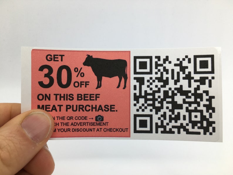 May include: A pink and white sticker with a black silhouette of a cow and the text "GET 30% OFF ON THIS BEEF MEAT PURCHASE." A QR code is on the right side of the sticker.