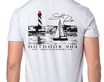 May include: White t-shirt with a black and white graphic of a lighthouse, sailboat, and the text "Salt Run" and "Outdoor 904 St. Augustine, FL".