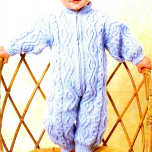 May include: A light blue knitted baby onesie with a zipper closure and a cable knit pattern.