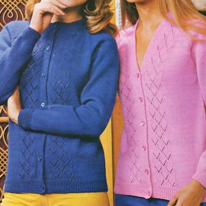 May include: Two women wearing knitted cardigans with button closures. The cardigan on the left is blue with a diamond pattern and the cardigan on the right is pink with a chevron pattern.