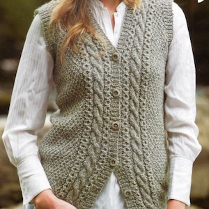 May include: A beige knitted waistcoat with a cable knit pattern and button fastening.