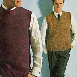May include: Two men wearing v-neck sleeveless sweaters over white shirts. The sweater on the left is a dark burgundy color and the sweater on the right is a brown and gold color.