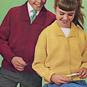May include: Two children wearing knitted cardigans. The boy is wearing a maroon cardigan with a green tie and the girl is wearing a yellow cardigan.