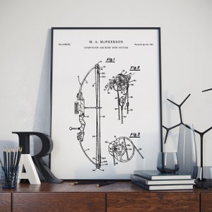 May include: Black and white patent drawing of a compound archery bow system. The drawing shows the bow in three different views. The patent number is 4,681,511 and the patent date is 28 April 1987. The patent is for M. A. McPherson.