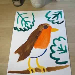 May include: A watercolor painting on white paper featuring a robin with a brown back, orange chest, and yellow beak perched on a brown branch. The bird is surrounded by stylized green leaves, and the signature Emypinks is written in the bottom right corner.