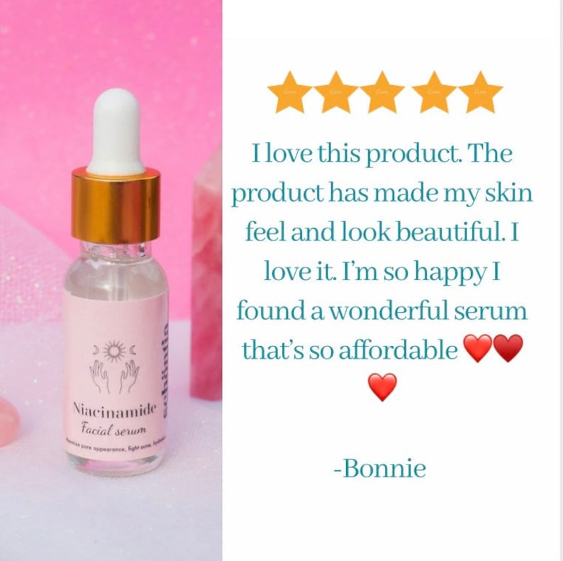 May include: A clear glass bottle of Niacinamide facial serum with a white dropper and gold cap. The label features a celestial design and the product name. The background is a soft pink.