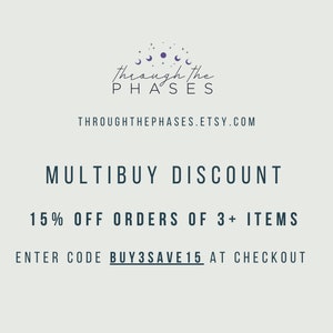 May include: A graphic with a purple moon and stars logo for a shop called "Through the Phases". The text "MULTIBUY DISCOUNT" is in black, and the text "15% OFF ORDERS OF 3+ ITEMS" is in black. The text "ENTER CODE BUY3SAVE15 AT CHECKOUT" is in black.