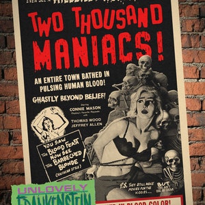 May include: A vintage movie poster for the horror film "Two Thousand Maniacs!" featuring a woman tied up with skulls and bones in the background. The poster text reads "An entire town bathed in pulsing human blood! Ghastly beyond belief!" and "You saw the blood feast now see the barbecued blonde (Southern style)". The poster also features the text "Unlovely Frankenstein stained in blood color!" and "Directed by Herschell G. Lewis."