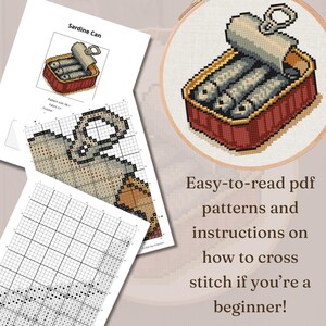 May include: A cross-stitch project featuring a sardine can design, displayed in a wooden hoop. Accompanying the project are printed PDF patterns and instructions. The text on the image reads: "Easy-to-read pdf patterns and instructions on how to cross stitch if you're a beginner!"