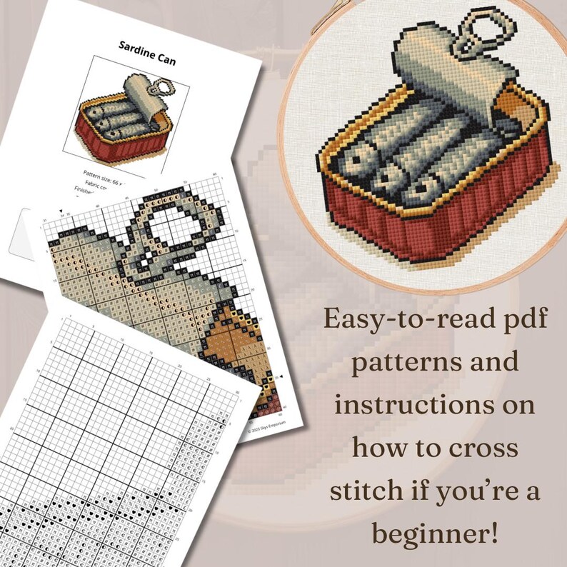 May include: A cross-stitch project featuring a sardine can design, displayed in a wooden hoop. Accompanying the project are printed PDF patterns and instructions. The text on the image reads: "Easy-to-read pdf patterns and instructions on how to cross stitch if you're a beginner!"