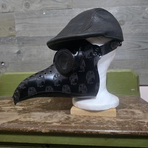 Leather Apple Cap and Plague Doctor Mask.