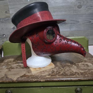 Leather Top Hat and Plague Doctor Mask.