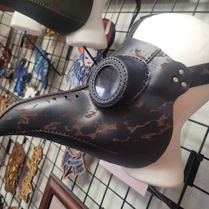 Handmade plague doctor masks compatible with glasses.