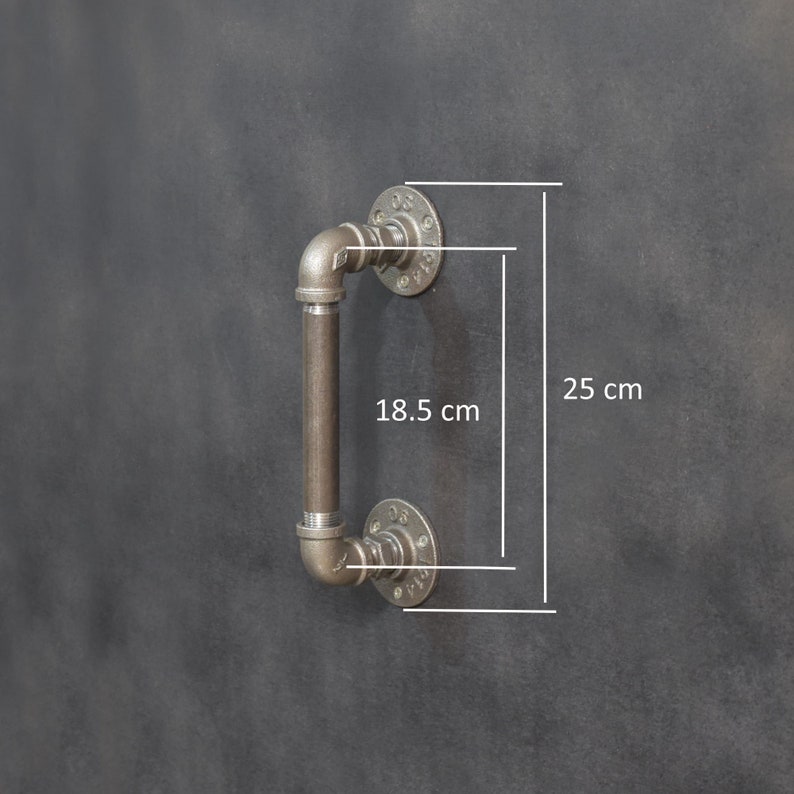 May include: A black metal industrial style door handle with a 18.5 inch long handle and 10 inch tall flanges.