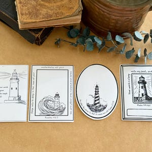 May include: Four black and white printable stickers with lighthouse illustrations and bible verses. The verses are "The unfolding of your words gives light; it gives understanding to the simple. Psalm 119:130", "Deep calls to deep in the roar of your waterfalls all your waves and breakers have swept over me. Psalm 42:7", "He calms the storm so that the waves are still. Psalm 107:29", and "Your word is a lamp unto my feet, and a light unto my path. Psalm 119:105".