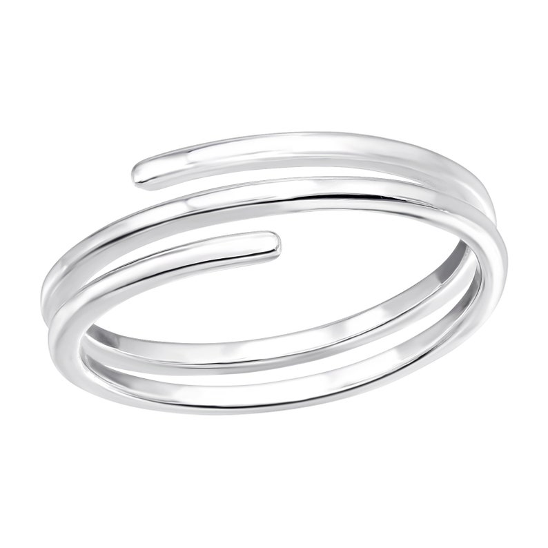May include: A silver ring with three bands that wrap around the finger.