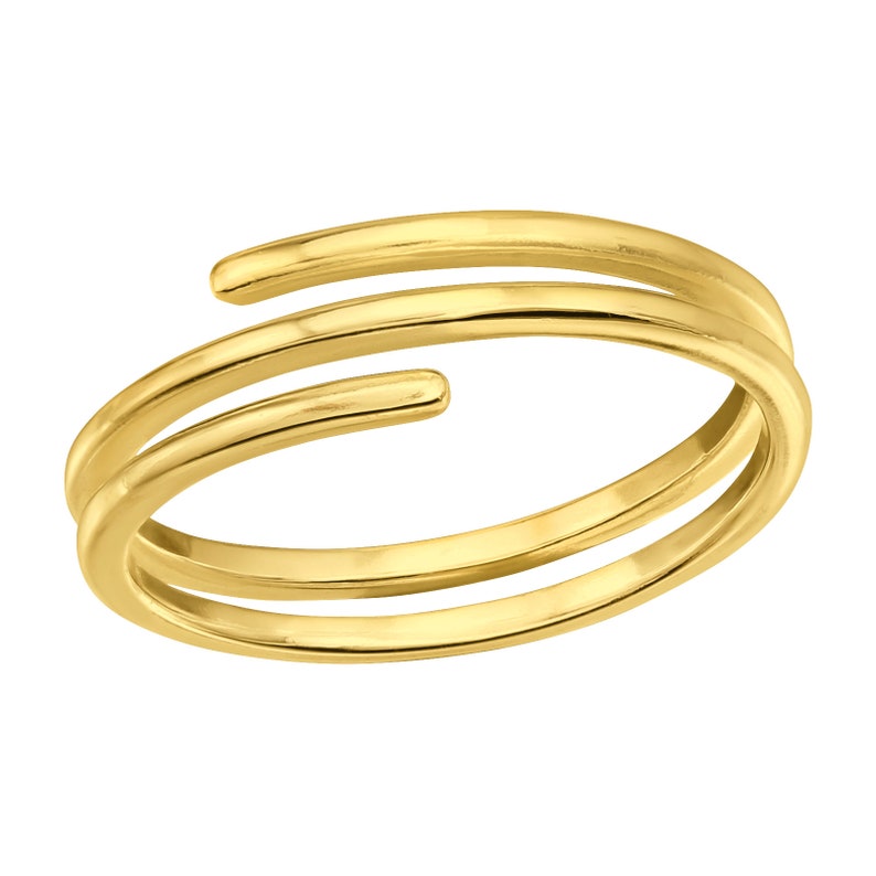 May include: A gold-toned, double-wrapped ring with a simple, minimalist design.