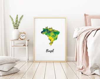 May include: A framed print of a watercolor map of Brazil with the word "Brazil" written in black below the map. The print is hanging on a white wall in a bedroom setting.