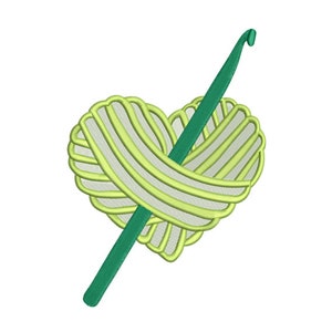May include: Green crochet hook wrapped around a heart-shaped ball of yarn.
