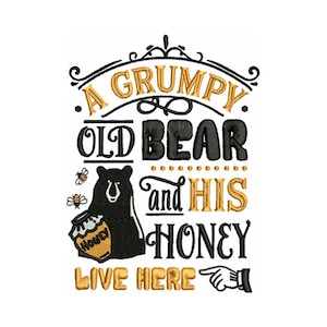 May include: A whimsical design featuring the text "A Grumpy Old Bear and His Honey Live Here." The design includes a black bear holding a honey pot, two bees, and decorative flourishes in gold and black.