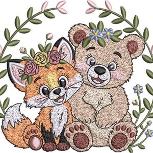 May include: An embroidered design featuring a fox and a bear, both smiling and adorned with floral crowns. The fox has orange and white fur, while the bear is light brown. They are surrounded by a green floral wreath, perfect for baby items.
