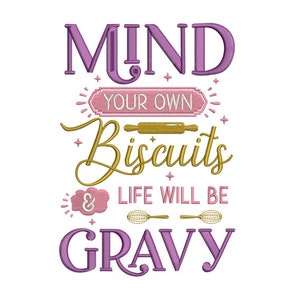 May include: Purple and gold embroidery design with the text "Mind your own biscuits & life will be gravy".