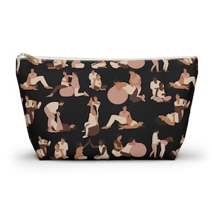 May include: Black cosmetic bag with a repeating pattern of figures in various poses. The figures are in shades of white, beige, and brown. The bag has a gold zipper and a white interior.