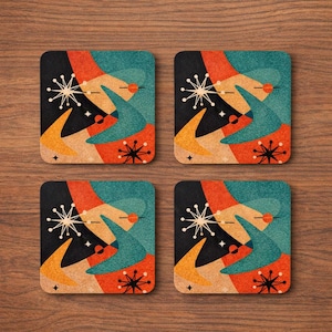 May include: Set of four square coasters with a retro atomic design. Each coaster features a black background with orange, teal, and tan boomerang shapes, starbursts, and small star accents. The coasters are placed on a wooden surface.