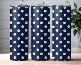 May include: Three stainless steel tumblers with lids and straws. The tumblers are navy blue with a white daisy pattern.