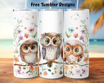 May include: Three white tumblers with a watercolor design of owls and flowers. The owls are brown, gray, and orange with green eyes. The flowers are pink, purple, blue, and orange.