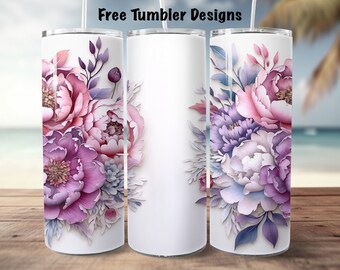 May include: Three stainless steel tumblers with a floral design. The tumblers are white with a pink, purple, and blue floral pattern. The tumblers are on a wooden surface.