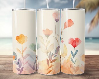 May include: Three stainless steel tumblers with a watercolor floral design. The tumblers are cream colored with a light orange, pink, and red floral pattern.