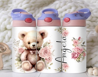 May include: Three stainless steel water bottles with a pink lid and a purple handle. The bottles feature a watercolor design of a teddy bear with pink roses and green leaves. The middle bottle has the name "Angela" written in black cursive.